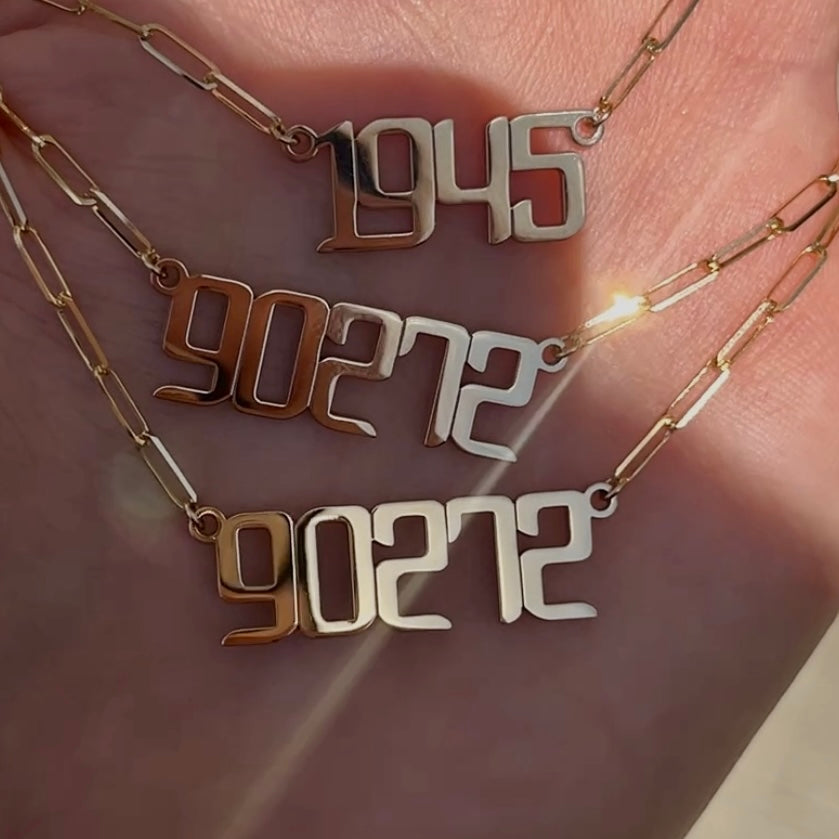 Gold nameplate necklaces with zip code 90272 and year 1945