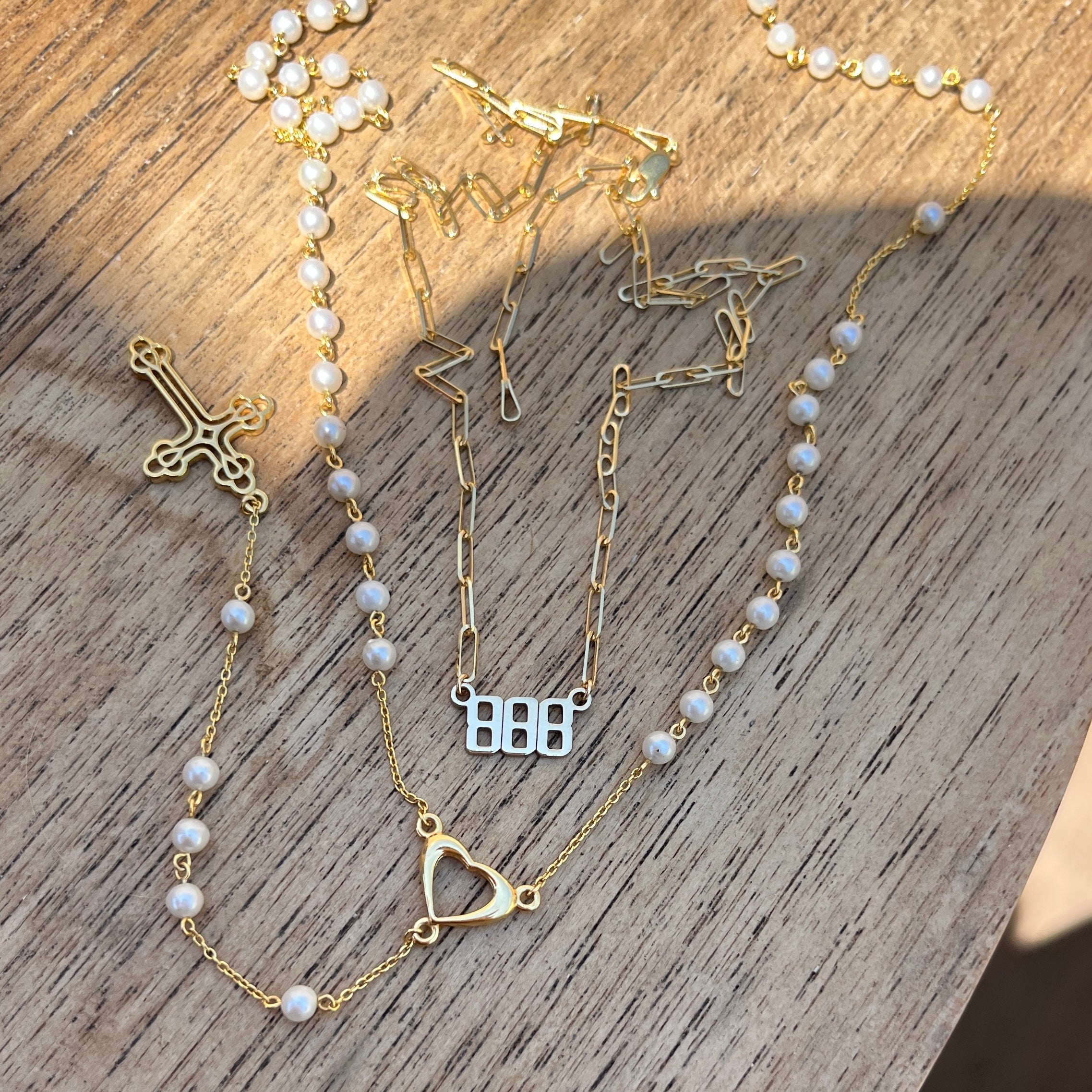 Pearl rosary necklace with 24k gold open heart and cross pendant with an 888 angel number necklace