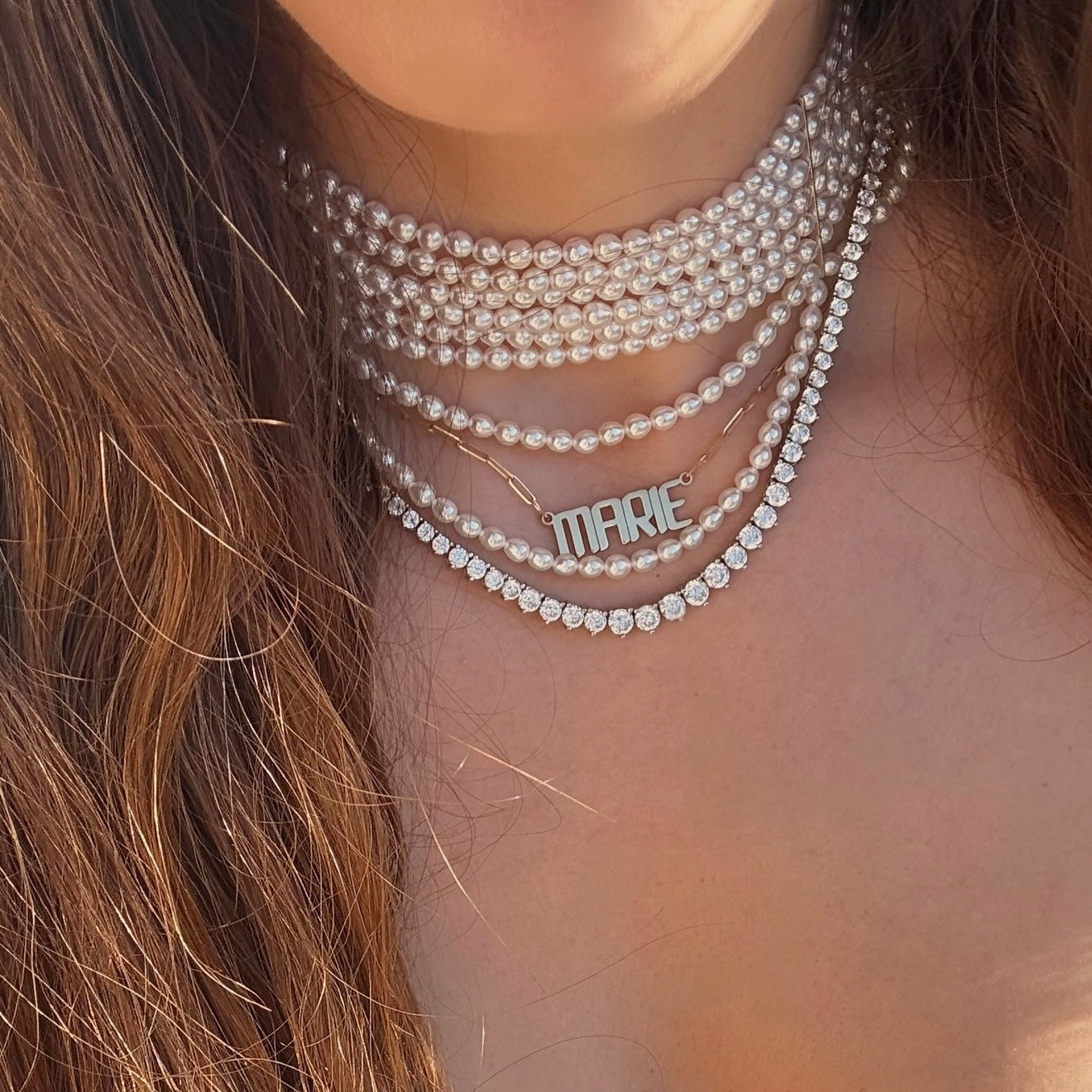 Pearl necklace choker with gold nameplate necklace and tennis necklace
