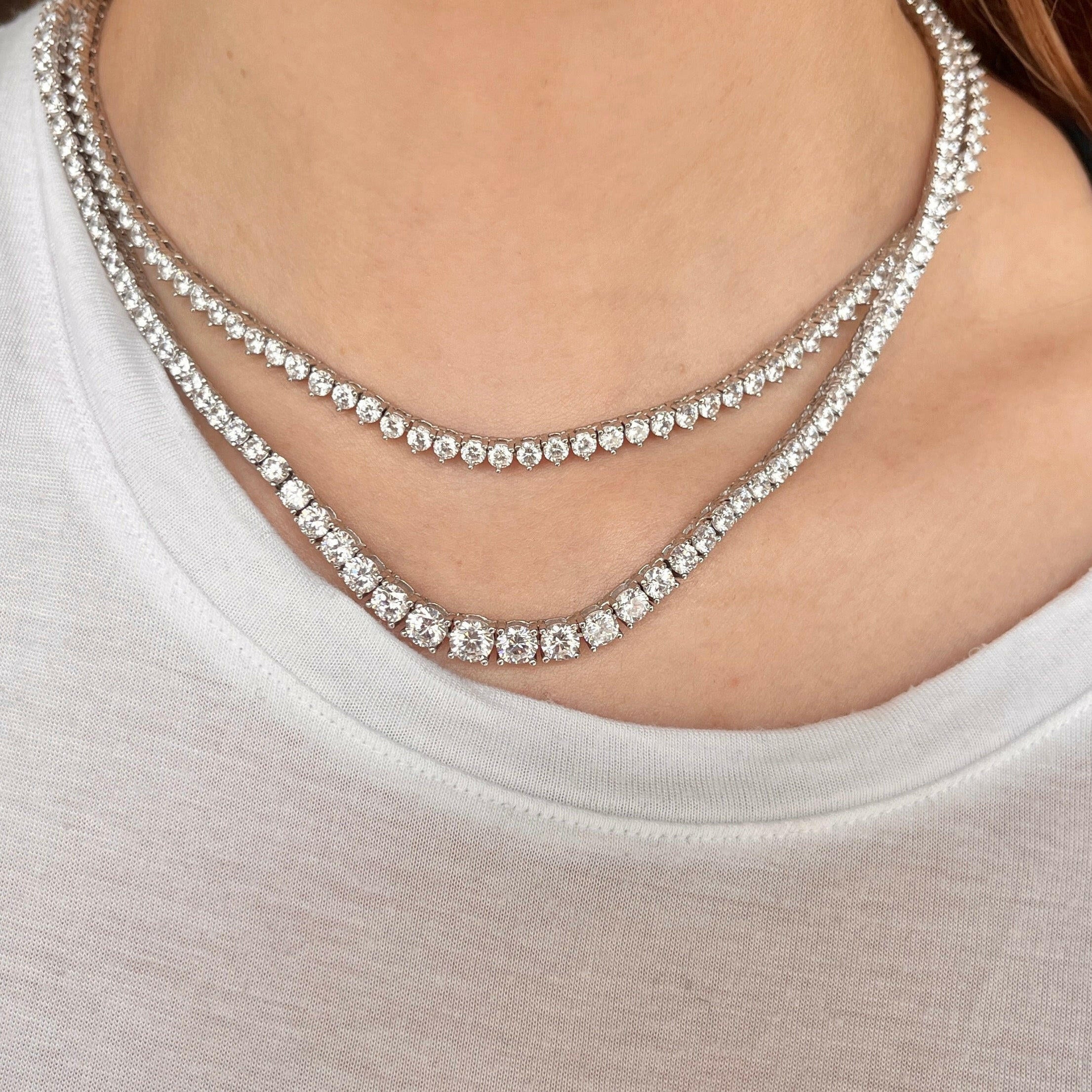 Our zircon tennis necklaces shown on neck