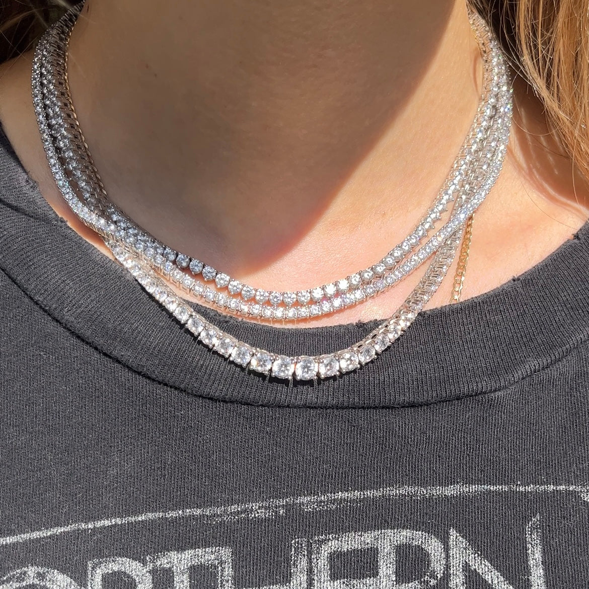 Faux tennis necklace by Leni James shown on a neck