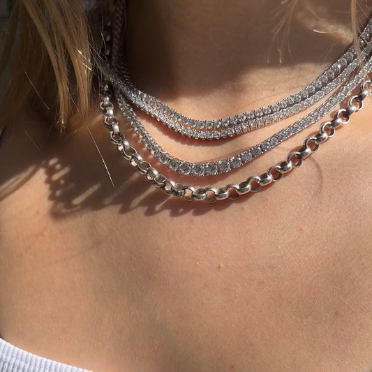 Four of our tennis choker necklaces displayed on a neck