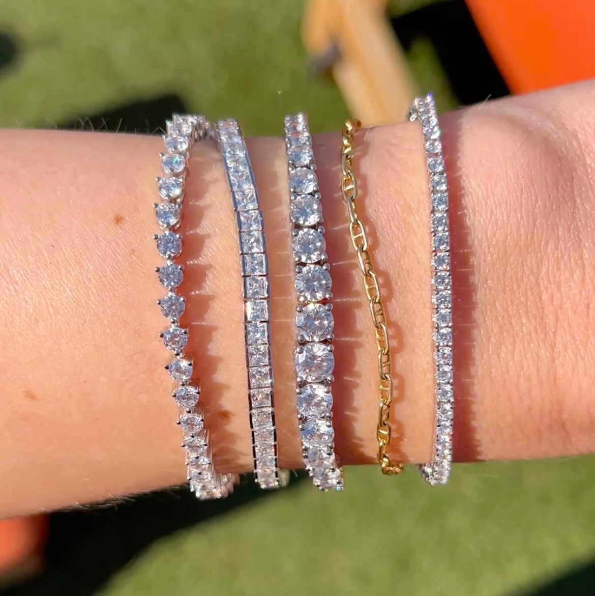Our faux tennis bracelets with our 3mm tennis bracelet, our princess cut tennis bracelet, our graduated tennis bracelet, and our thin tennis bracelet
