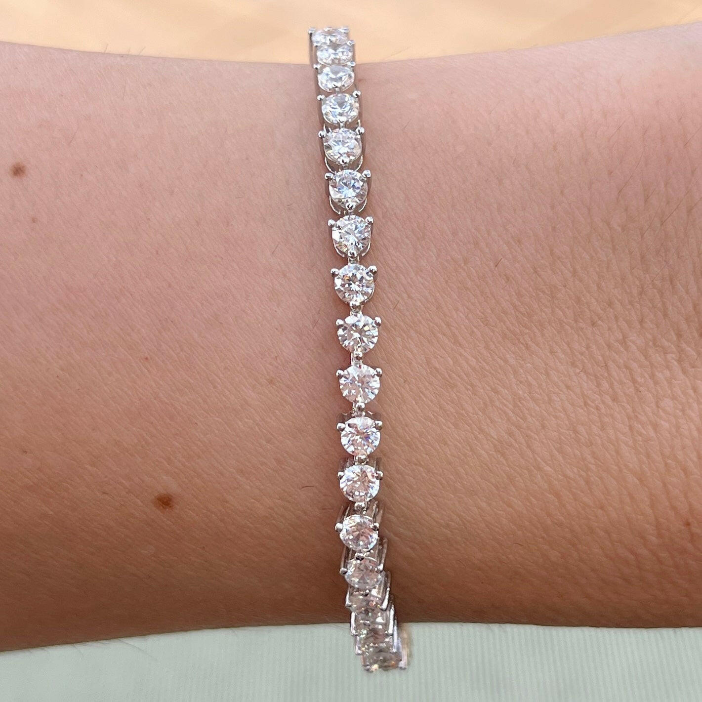 Our 3 prong 3mm tennis bracelet shown on wrist 