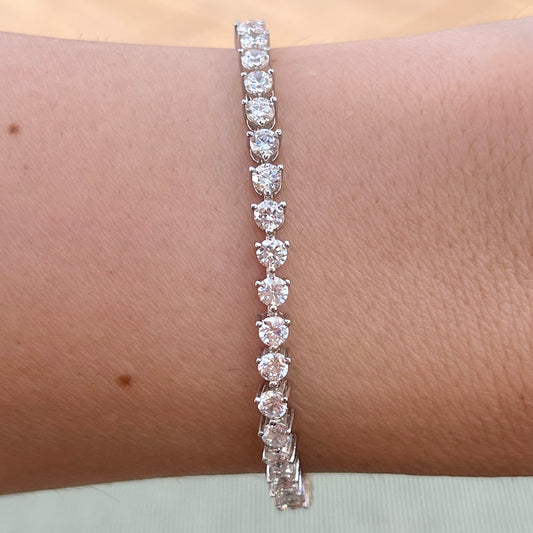 Our 3 prong 3mm tennis bracelet shown on wrist 