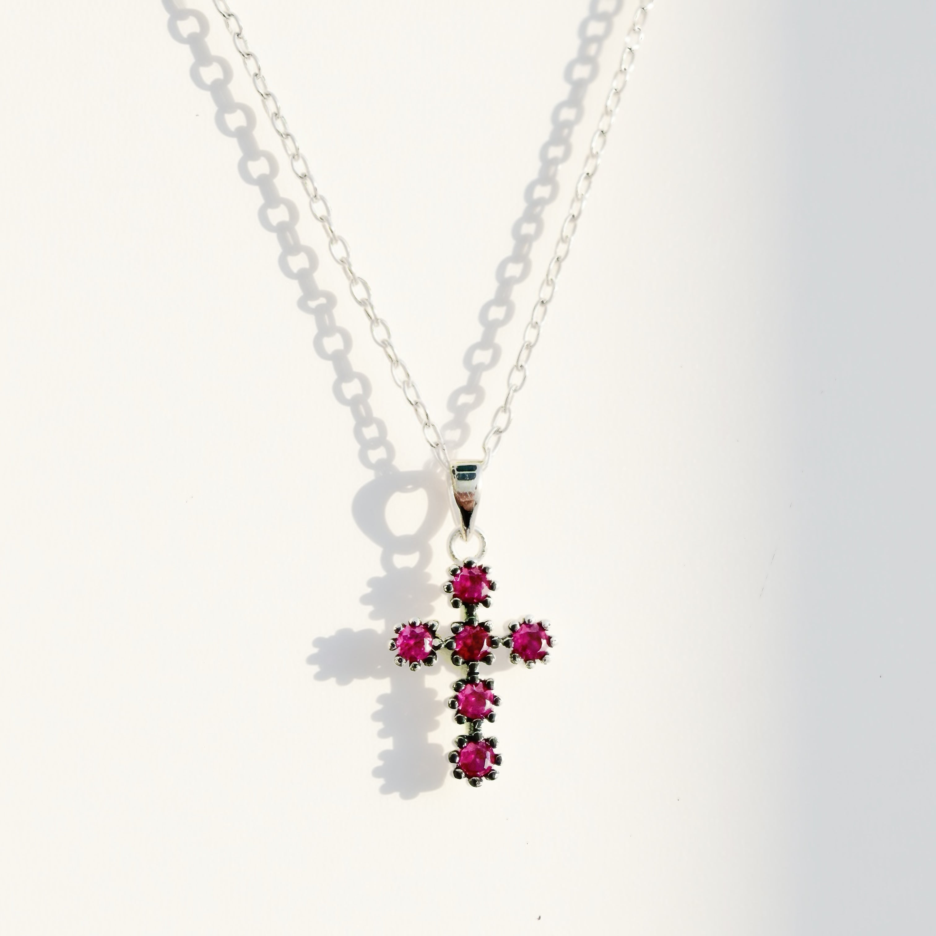 Bailey pink ruby mini cross necklace in sterling silver 
