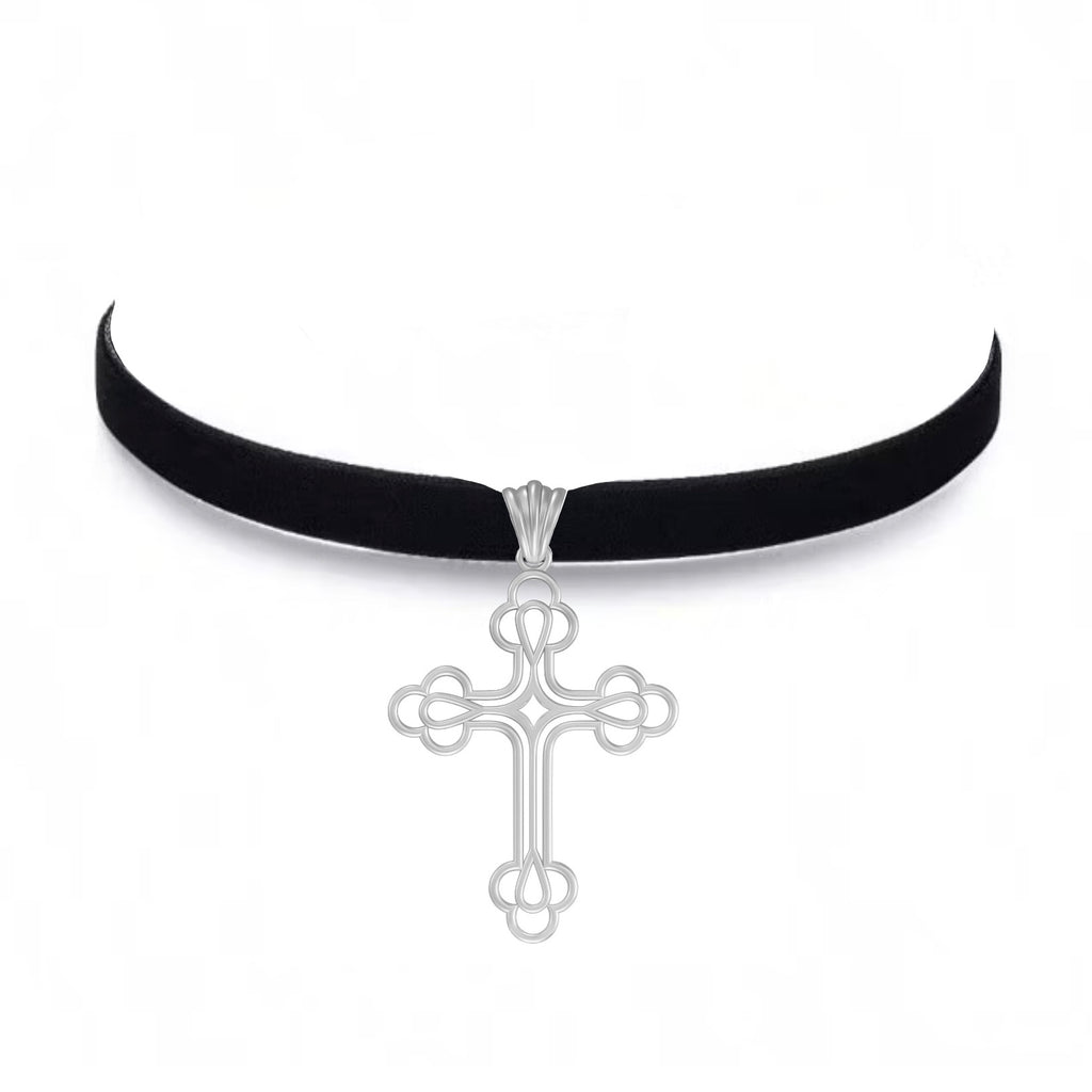Black velvet choker with a silver cross pendant on a white background