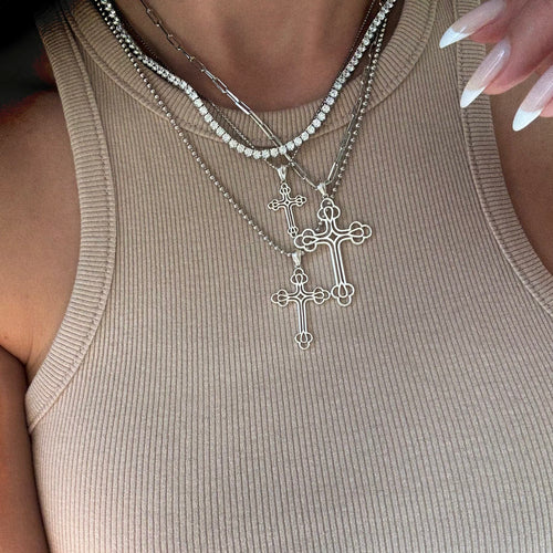 Our Billie cross pendant in 3 sizes worn with a tennis necklace 