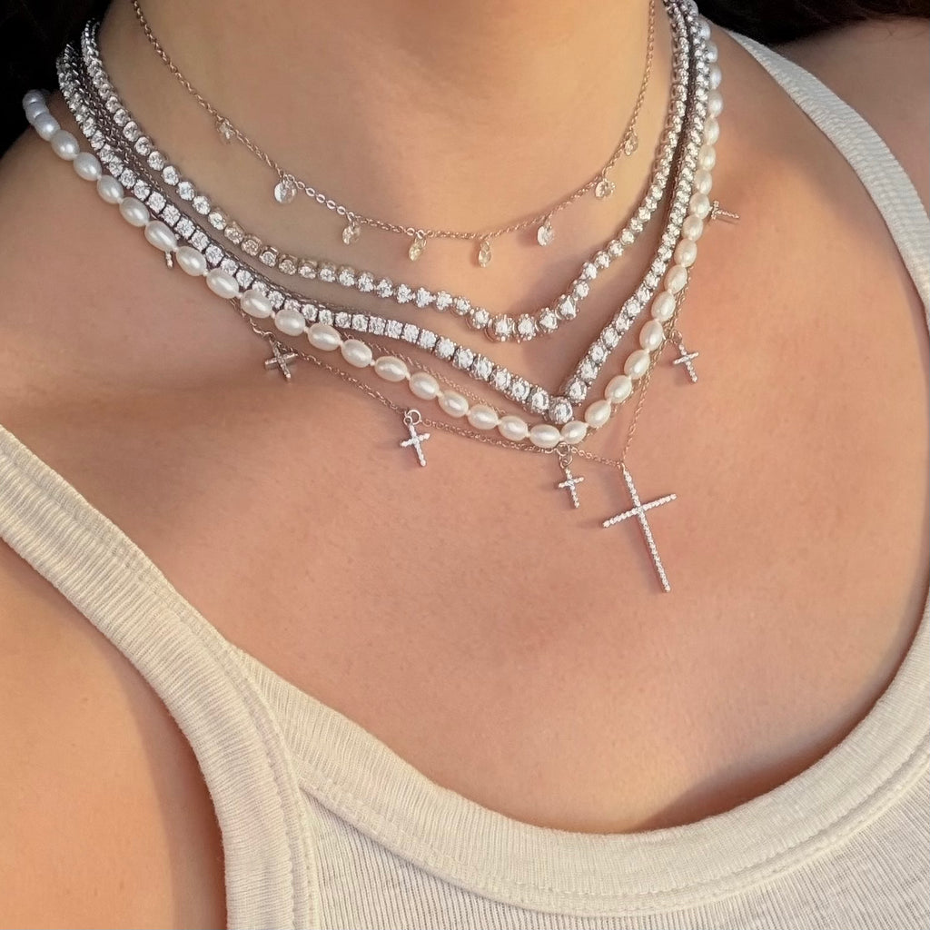 Cross necklaces with pearls and tennis necklaces 