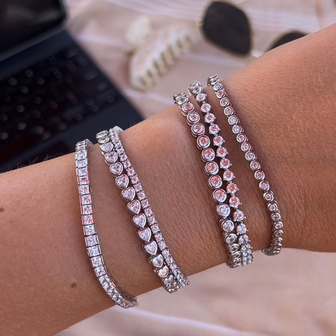 Faux tennis bracelets on a wrist 
