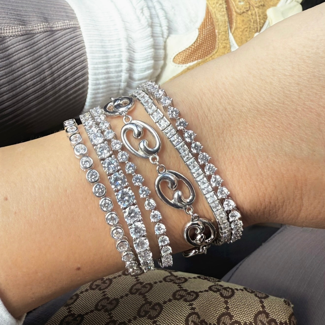 Worst stack with Fibonacci link silver bracelet and tennis bracelets 