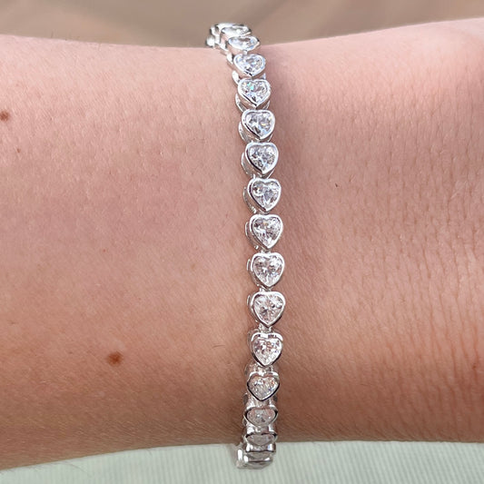 Our heart bezel tennis bracelet shown on wrist