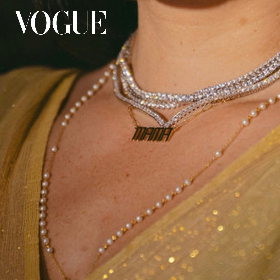 Leni James in Vogue with a stack of tennis necklace, a gold Mama nameplate necklace and a pearl rosary