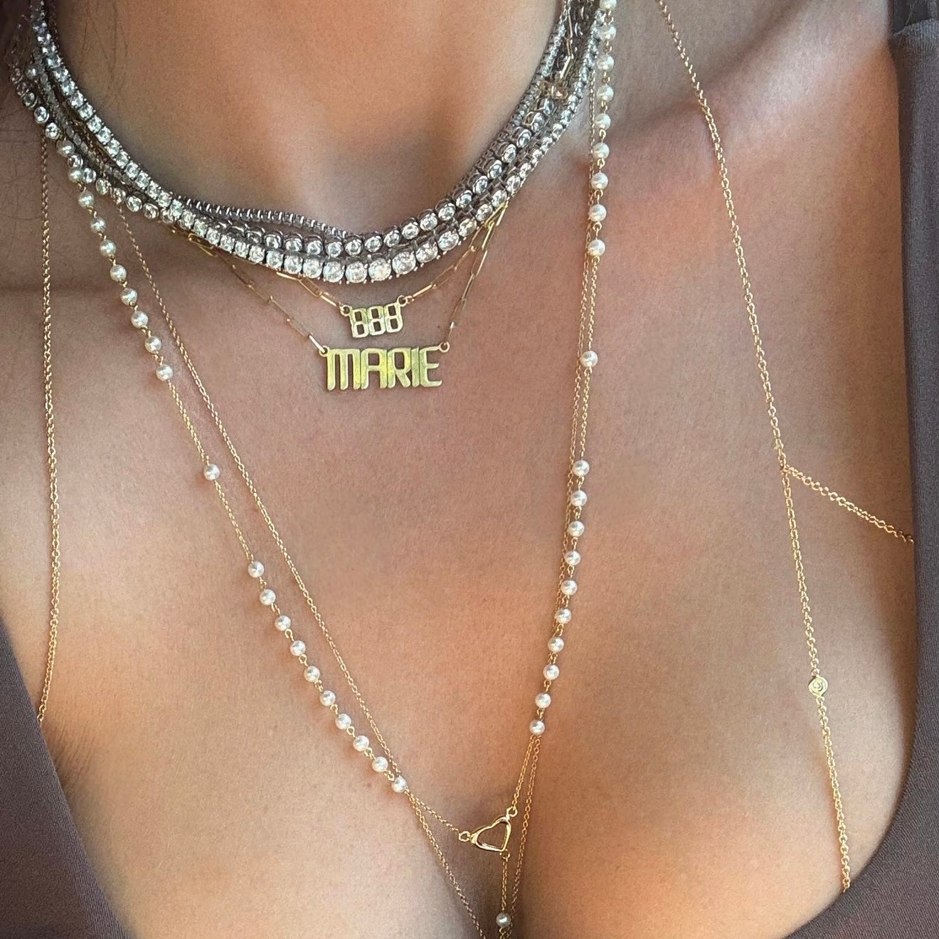 Pearl rosary necklace with tennis necklaces and gold nameplate and 888 angel necklace 