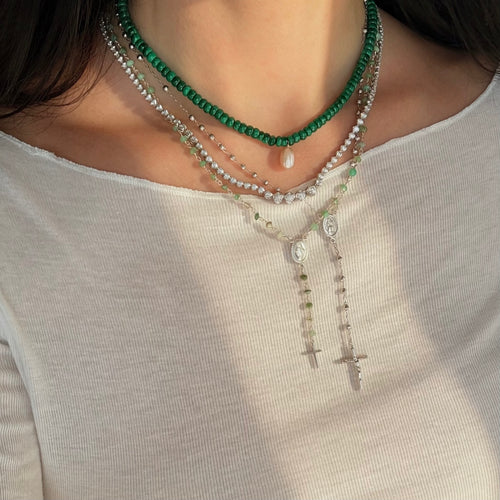 Malachite beads with a tennis necklace layered with sterling silver and green rosaries