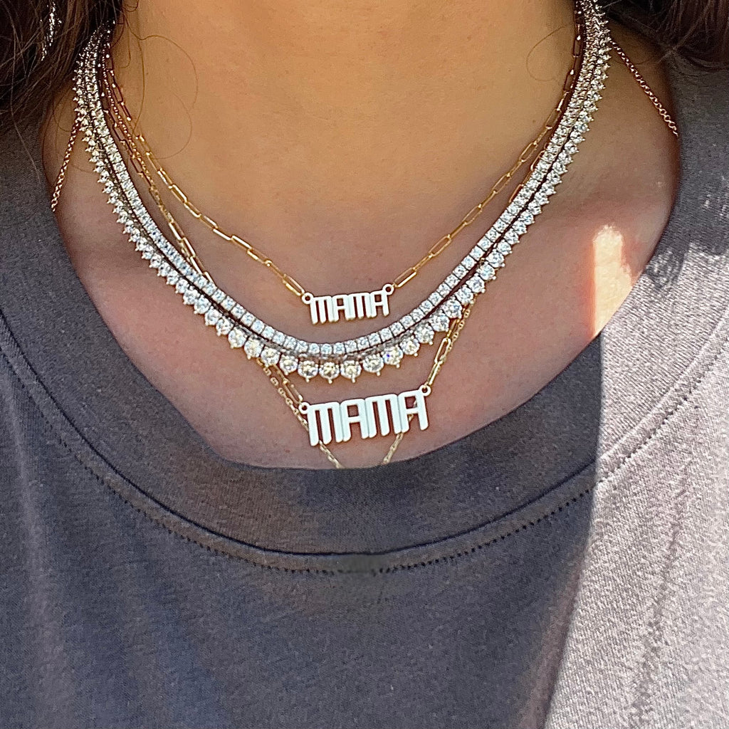 Mama gold necklace in our mini and signature size worn with tennis necklaces 