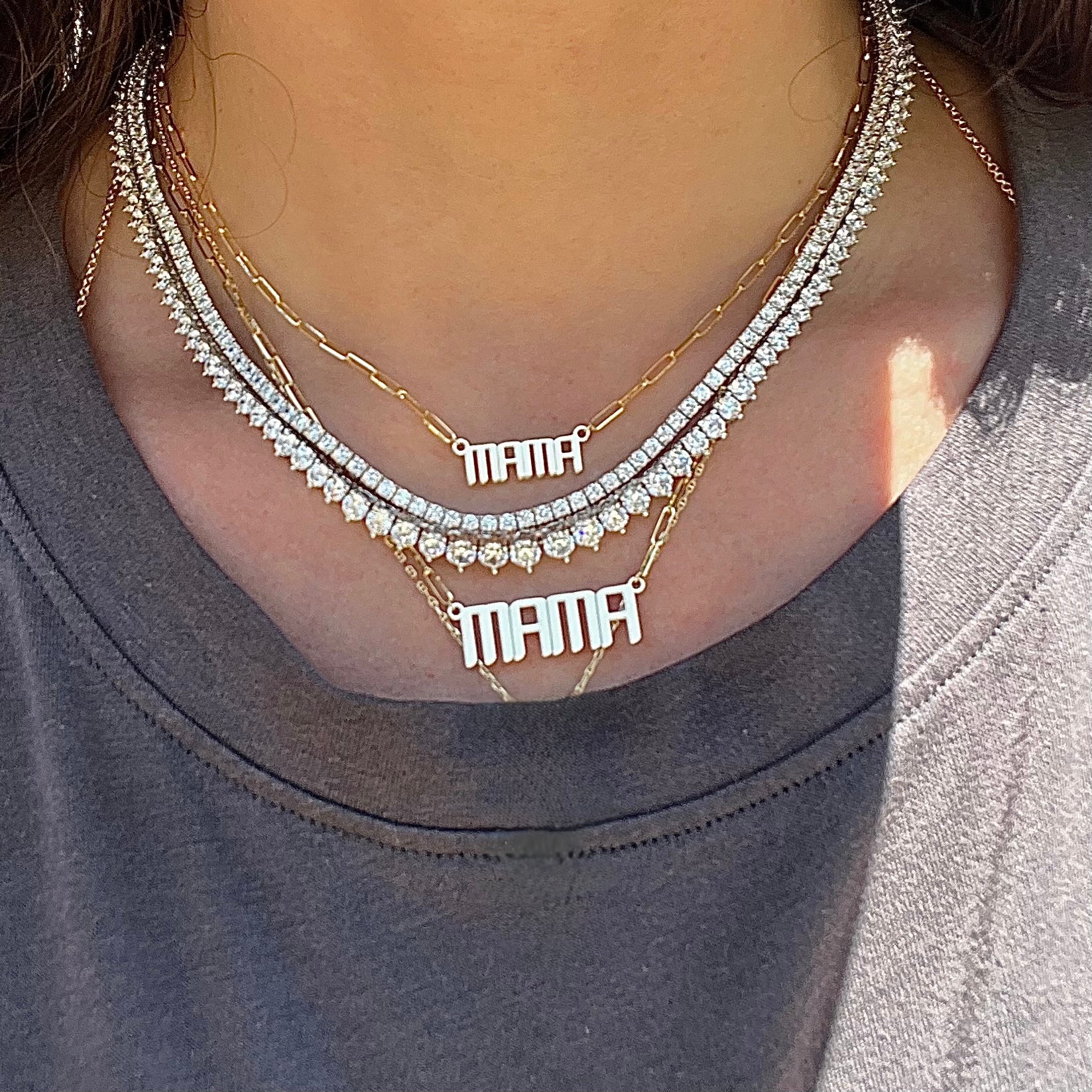 Mama gold necklace in our mini and signature size worn with tennis necklaces 