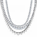 Three diamond necklace set on a white background