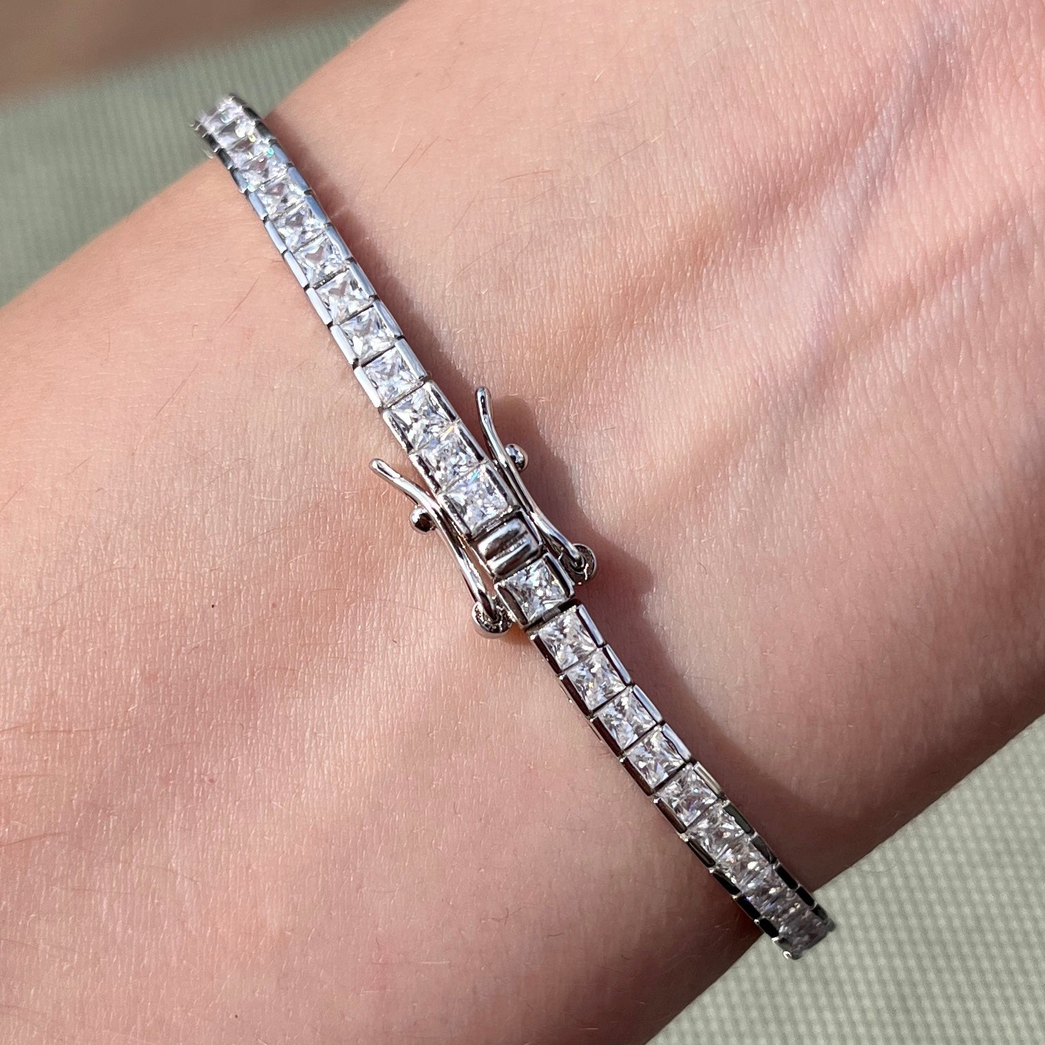 Clasp for our princess cut channel set tennis bracelet shown on wrist