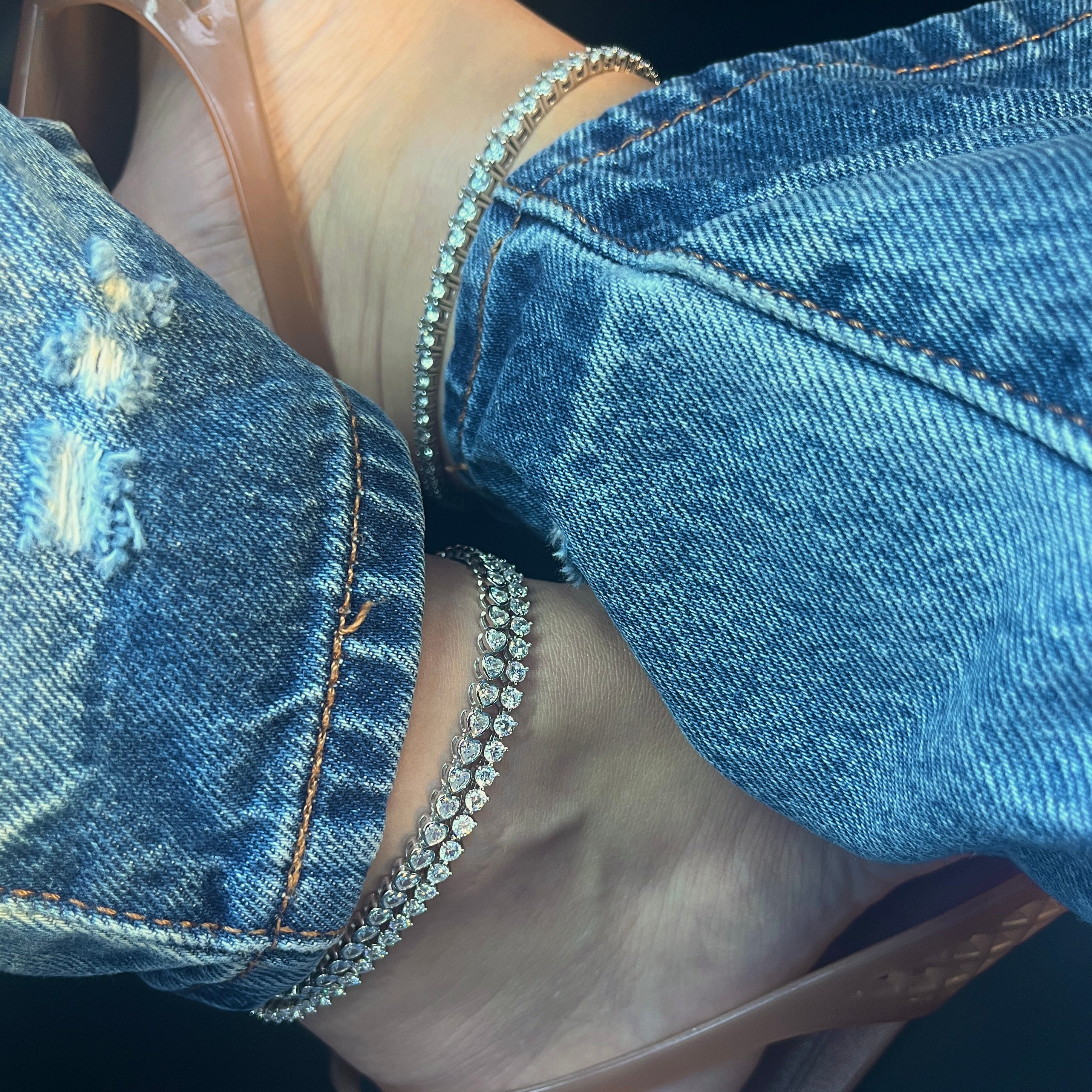 Tennis anklets with denim jeans and flat sandals