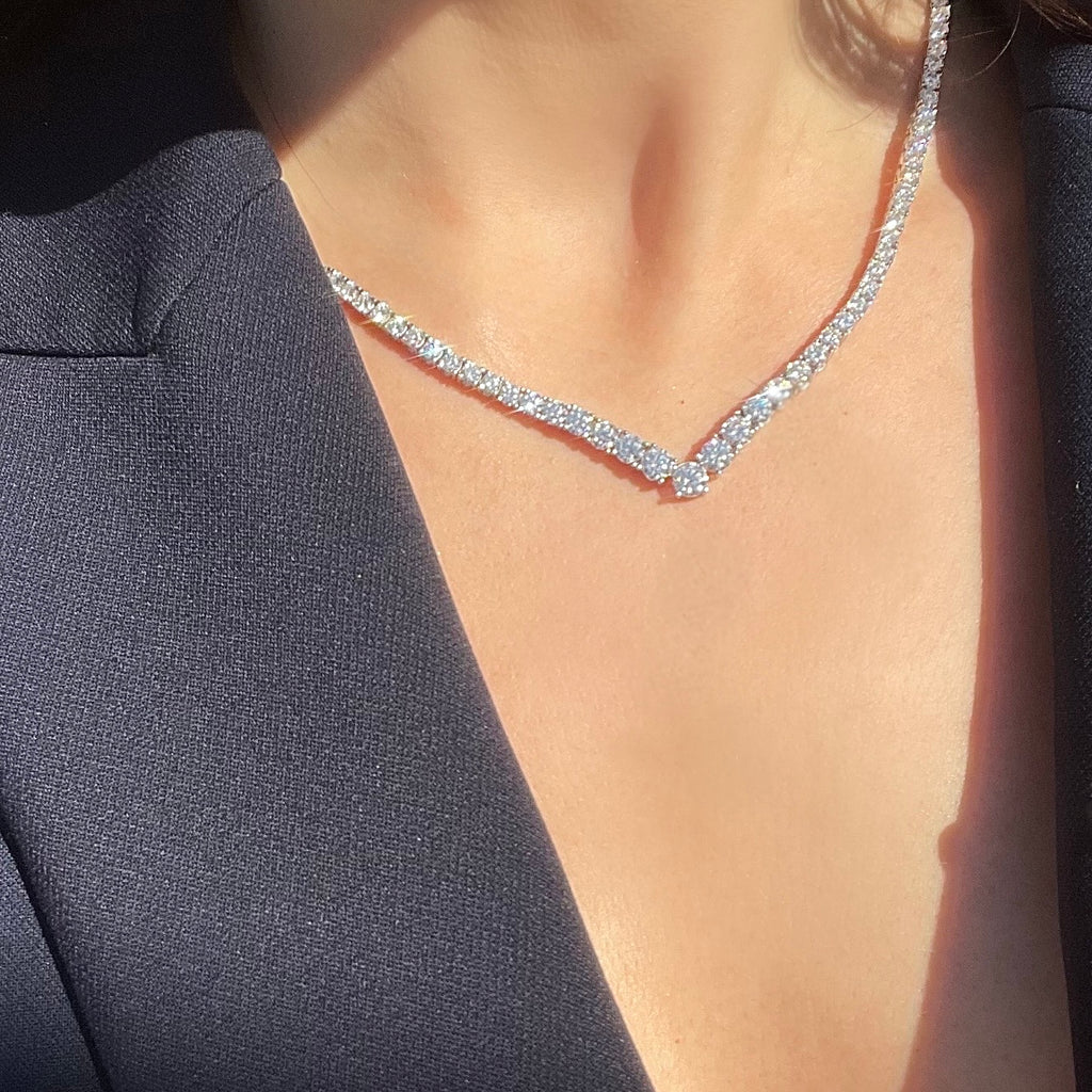 V-shaped tennis necklace sparkling in the sun