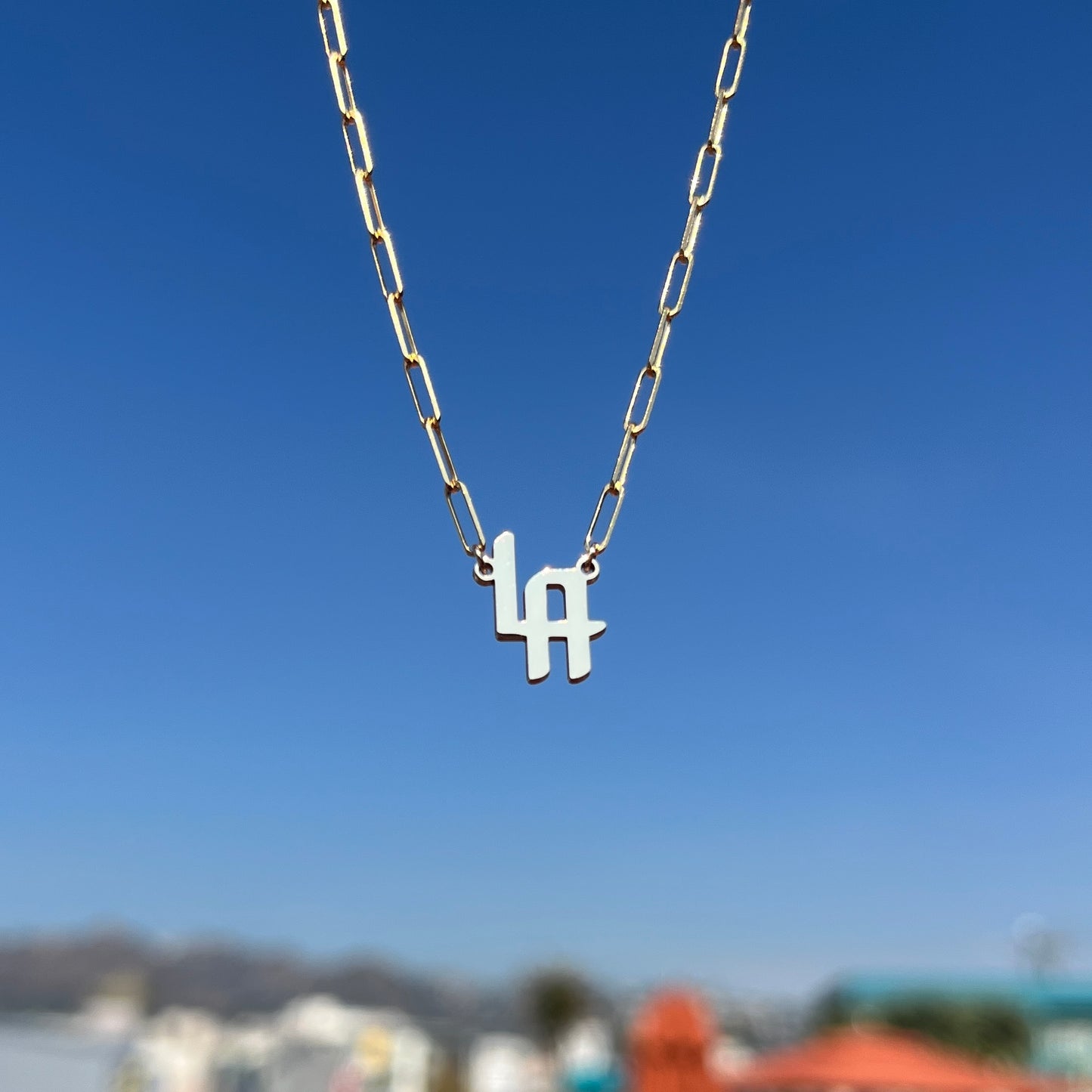 LA necklace in 14k yellow gold with our signature font