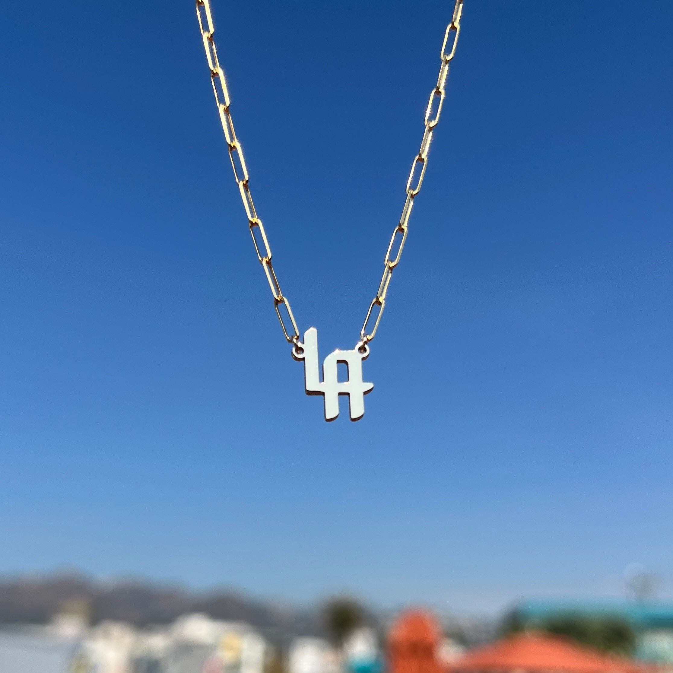 LA necklace in 14k yellow gold with our signature font