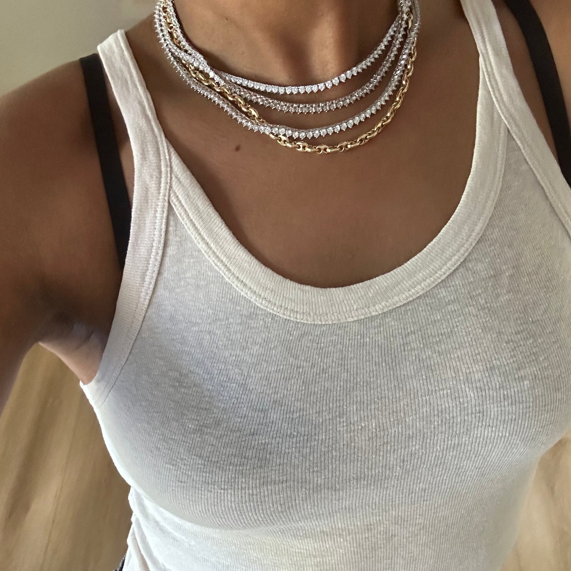 Our moissanite tennis necklaces shown on neck