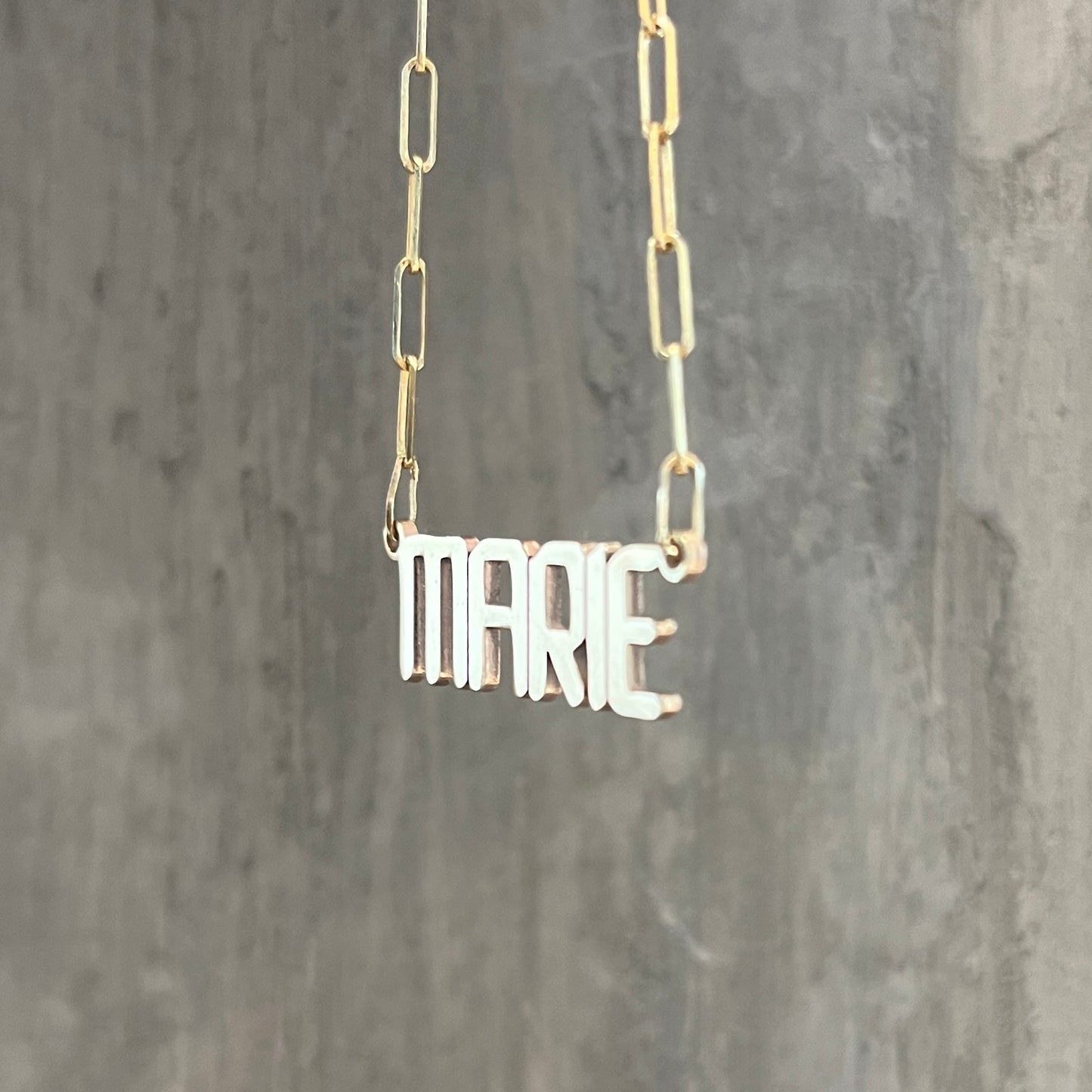 Side detail of our custom nameplate necklace with our signature font