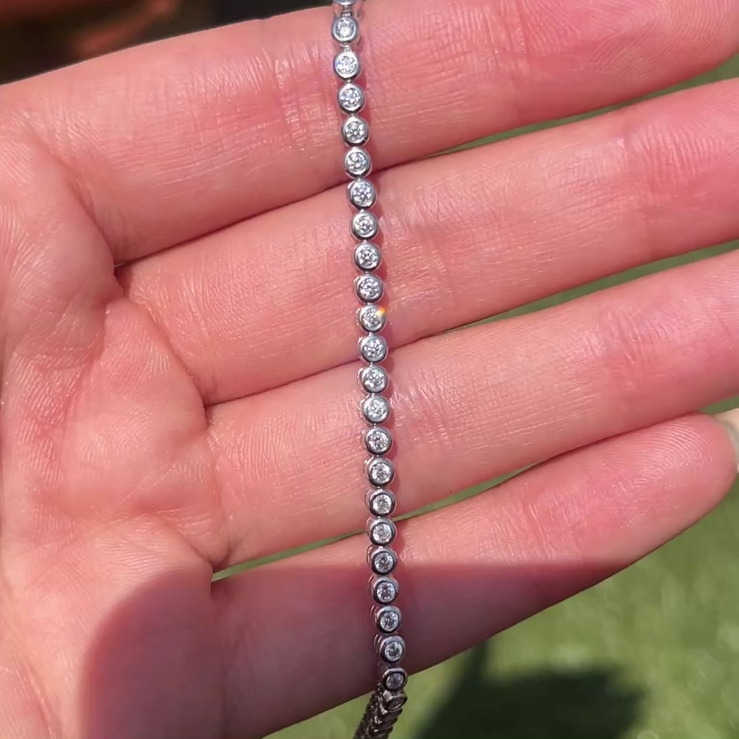 Closeup of our 2mm round bezel Poppy tennis bracelet 