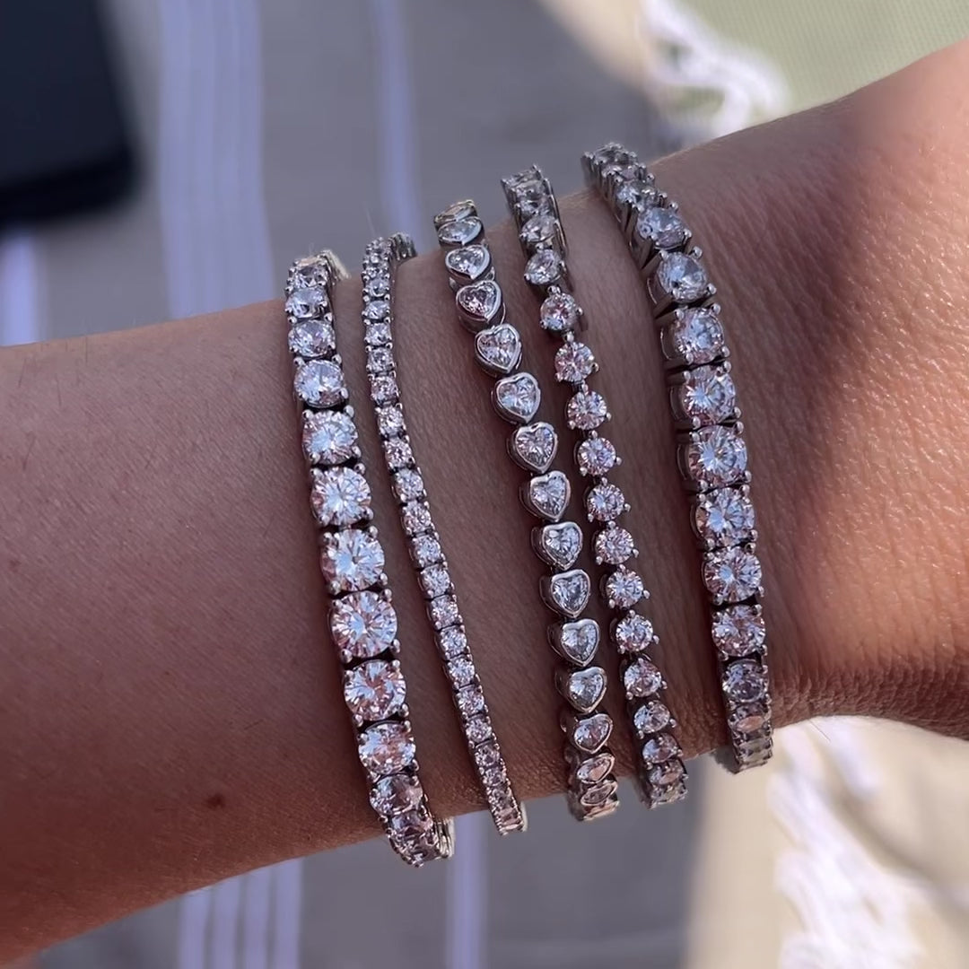 Leni James tennis bracelets on a wrist in the sun