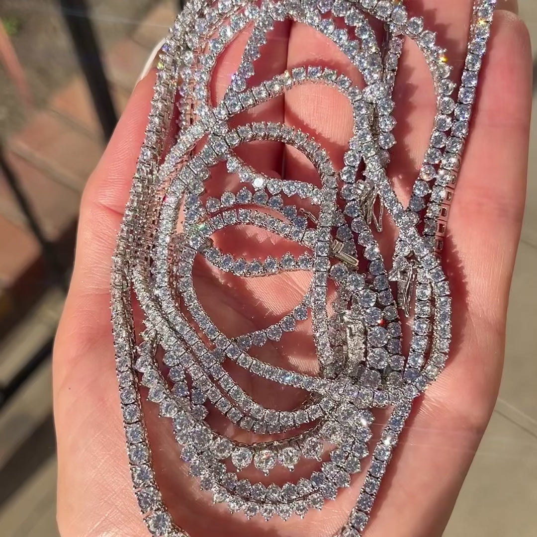 Closeup of diamond tennis necklaces sparkling in the sunlight